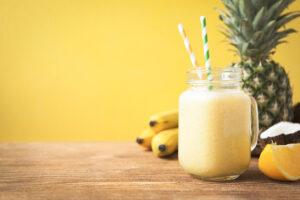 Fresh exotic smoothie with fruits and coconut milk